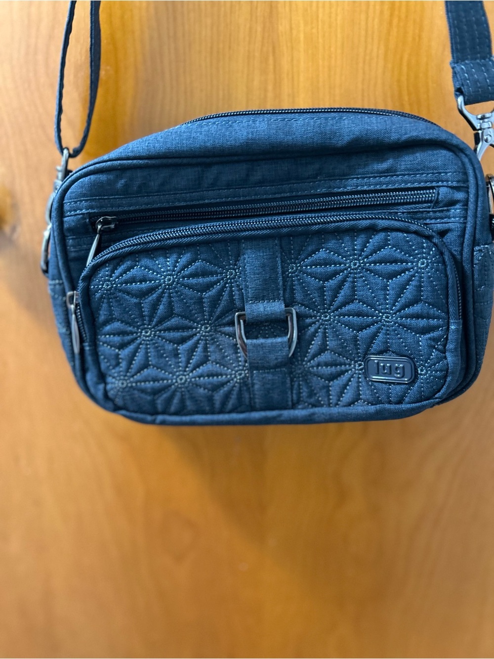 Lug Carousel Quilted Crossbody Bag in Navy Blue